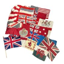 A range of 14 vintage Flags and Banners. Including Red Ensign, US, British Empire, Wales, Boer War