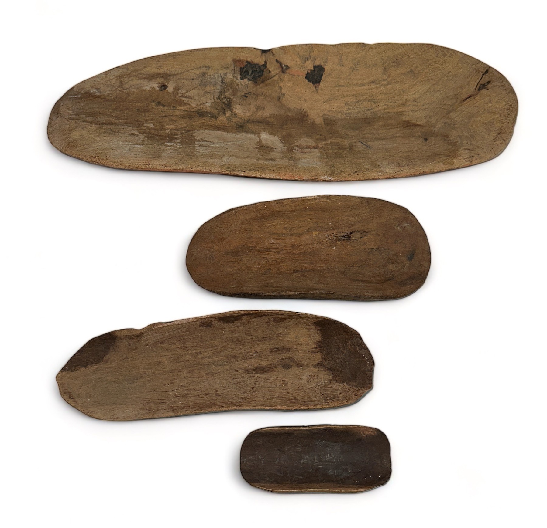 Aboriginal Coolimon sometimes called Yandi Dishes, set of four largest 47cm x 15cm, 27cm x 8cm, 23cm