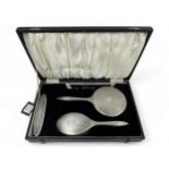 A silver mounted dressing table set by Broadway & Co., Birmingham 1994, comprising hand brush,