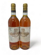 Two bottles of dessert wine Chateau Coutet a Barsac 1989 , Premier Cru Classé. Some damage to