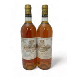 Two bottles of dessert wine Chateau Coutet a Barsac 1989 , Premier Cru Classé. Some damage to