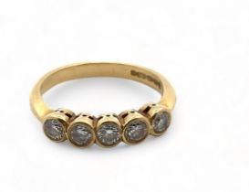 An 18ct gold collet set five stone diamond ring, size J. Weight 2.8g.