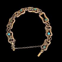 A turquoise and seed pearl gate link bracelet stamped 9ct, one pearl missing. Weight 12.9g