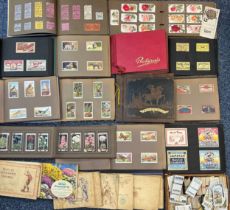 A collection of cigarette cards, in albums and loose, with ranges by Carreras, Cope, Gallaher,