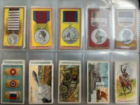 Collection of cigarette cards, part sets and type cards in plastic sleeves, in an album, in mixed