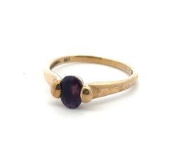 An amethyst single stone ring stamped 9ct. Size M. Weight 2.26g. Chip to amethyst, shank