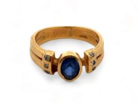 A sapphire ring, with diamond set shoulders stamped 18ct/ 750, size J. Weight 3.98g. Please see