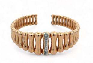 Chimento - an 18ct rose gold 'Bamboo' torque bangle. Of hollow construction with graduated curved