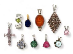 A collection of 10 gem set 925 pendants. Includes emerald, topaz, tanzanite, peridot etc. Please see