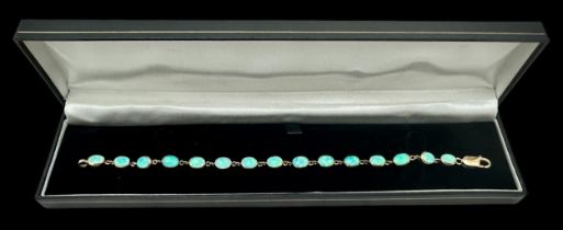 Blue opal line bracelet stamped 9ct. Length approx 19cm. Weight 9.9g. Please see the buyer's terms