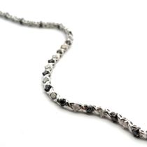 A 9ct white gold diamond and haematite bracelet. Length approx 20cm. Weight 9.45g. Please see the