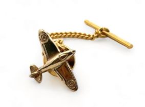 A 9ct gold tie pin in the form of a Spitfire. Hallmarks to post. Please see the buyer's terms and