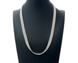 A hallmarked 9ct white gold 'panther' style necklet with trigger style clasp/ Length 47cm. Weight