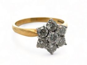 An 18ct gold and diamond flower ring. Size O. Weight 4.71g. Estimated diamond weight 0.9ct. Please