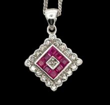A ruby and diamond 18ct white gold pendant necklace. Hallmarks to pendant and 18"chain. Pendant 17mm