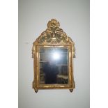Alter Spiegel mit Stilelementen des französischen Empire; Holzkorpus mit aufgesetzten Schmuckelemen