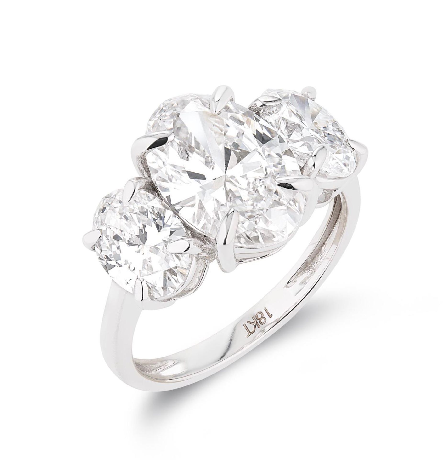 Oval Brilliant Cut 5.07ct Trilogy Ring F Colour VS1 Clarity -Set 18KT White Gold- IGI CERTIFIED