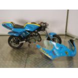 Mini Moto motorcycle in Rizzla blue livery. Runs and rides