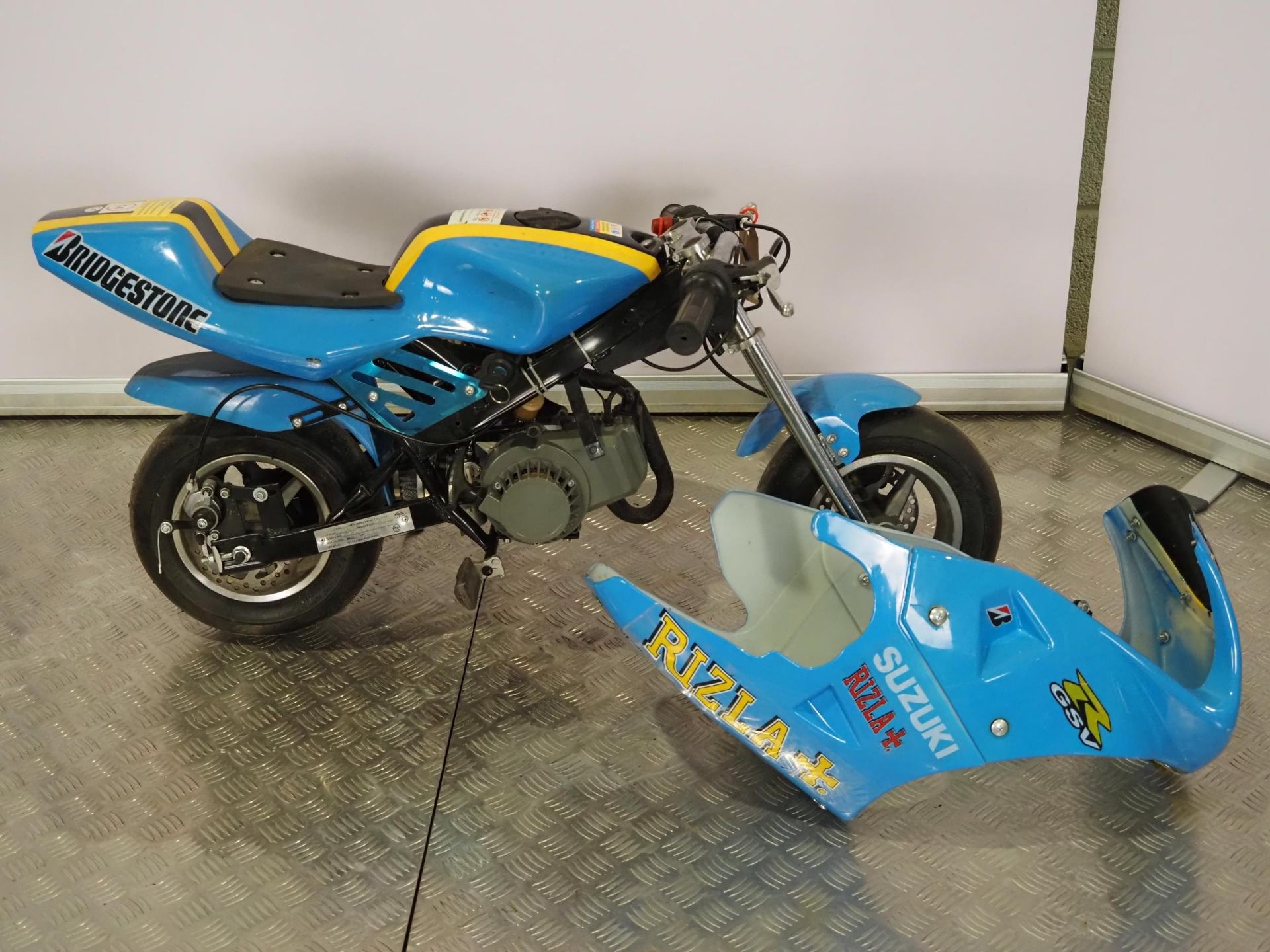 Mini Moto motorcycle in Rizzla blue livery. Runs and rides