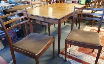 G-Plan Kofod Larsen Extending rectangular Table in teak, accompanied by 4 chairs in original velvete