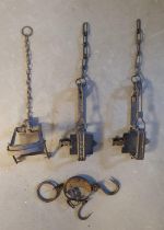 Set of Four Antique Wrought Iron Man Traps and Weights
