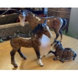 Beswick Brown Horse and a Pair of Brown Foals 18cm x 23.5cm, 16cm x 15.5cm, 9cm x 13cm