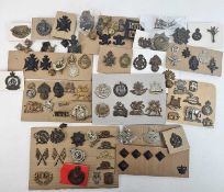 A large accumulation of British and foreign Army cap badges and buttons together with a large