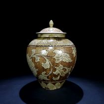 Song Dynasty Ding kiln sauce jar with carved peony pattern lid