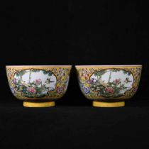 A pair of enamel window-shaped longevity bowls with flower and bird patterns, made during the Yongzh