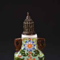 Painted enamel snuff bottle with lotus pattern on it