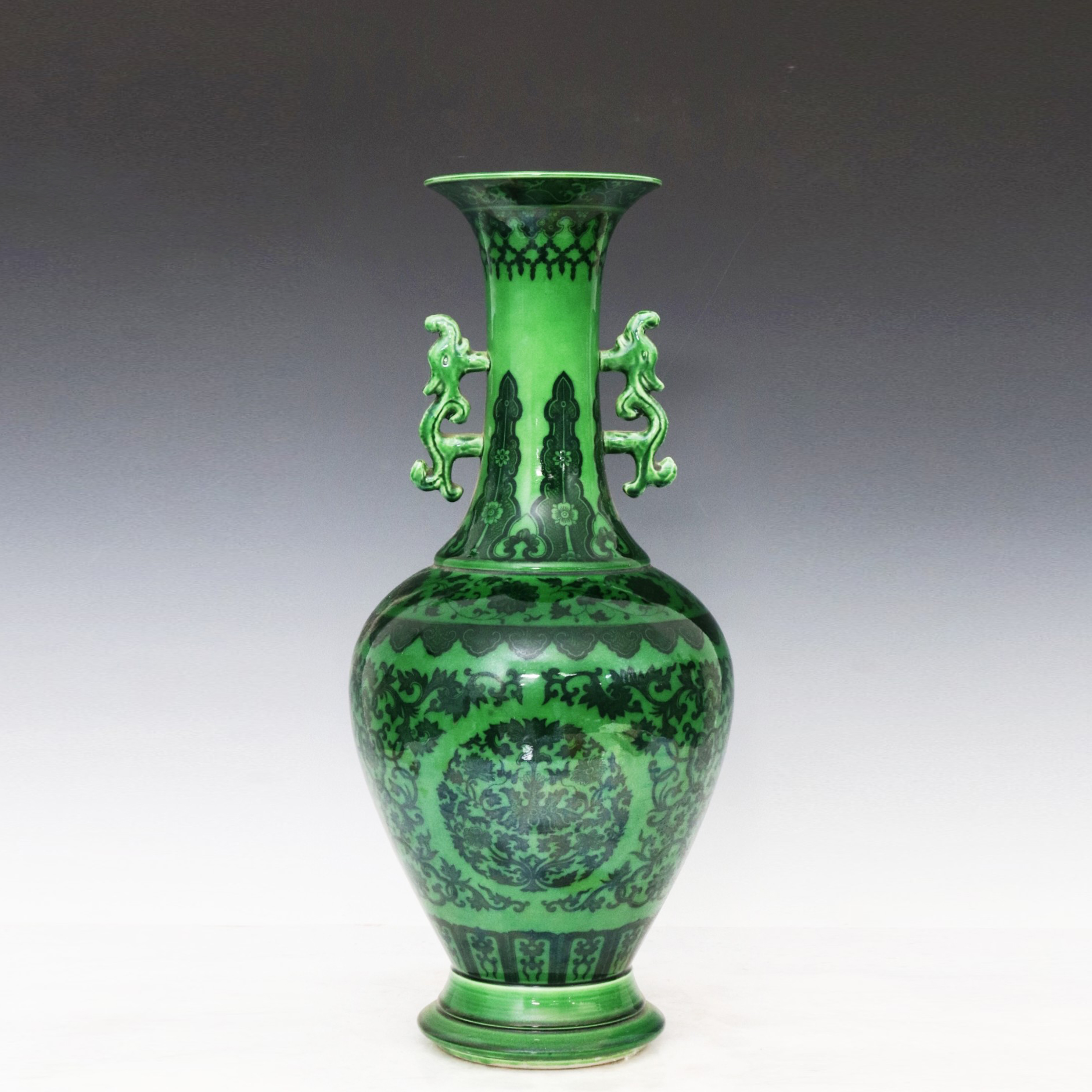Green-glazed ink-color lotus double-dragon-ear vase made during the Qianlong period of the Qing Dyna