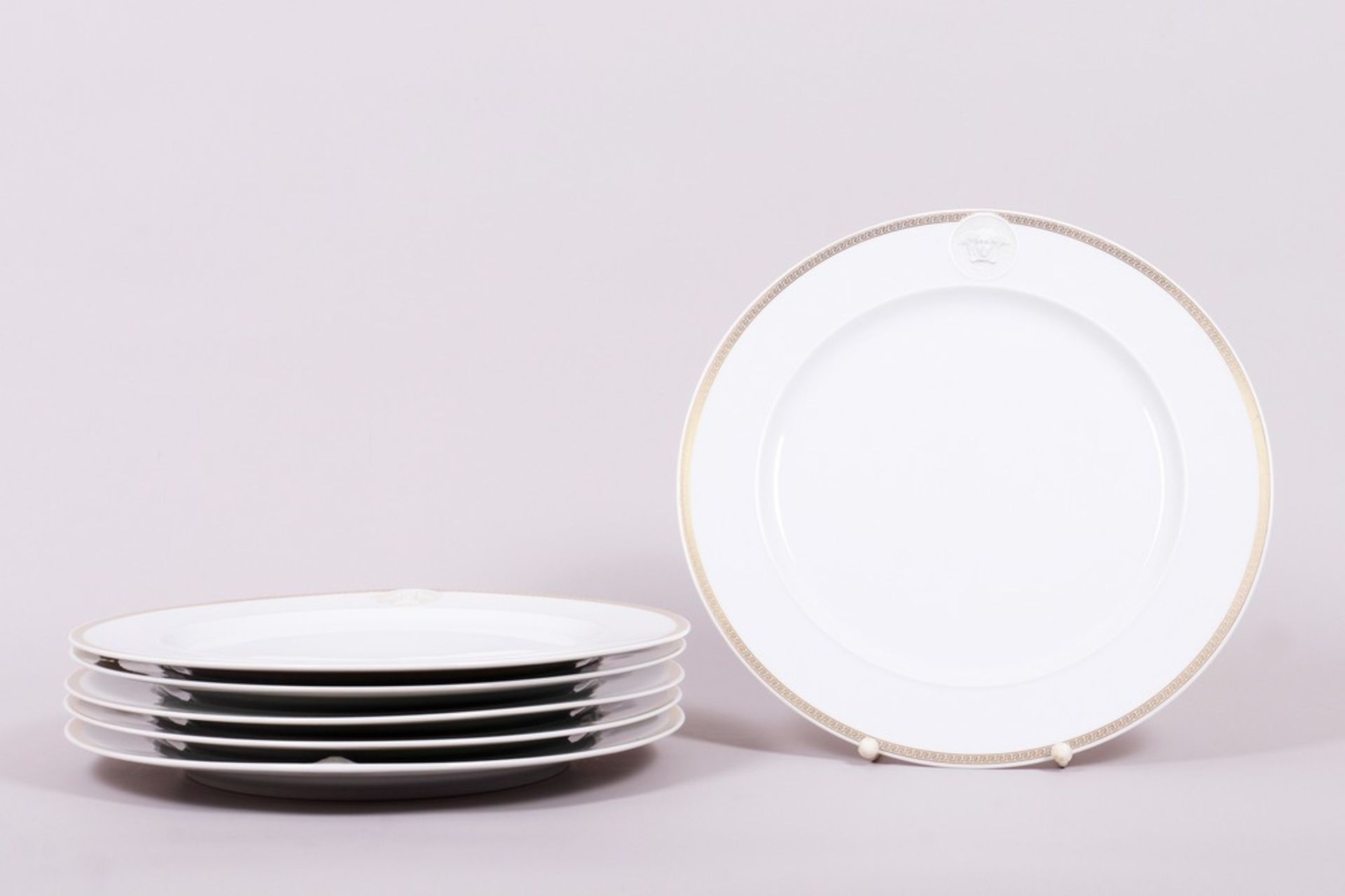 Six charger plates, “Icarus”, design Paul Wunderlich/ “Gorgona” decor by Gianni Versace for Rosenth