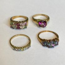 Collection of four 9ct yellow gold gem set rings. To include a mystic topaz and diamond ring, a