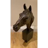 A Bronzed head of Red Rum the famous racehorse.  63cm tall with a good patination finish