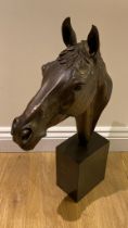 A Bronzed head of Red Rum the famous racehorse.  63cm tall with a good patination finish