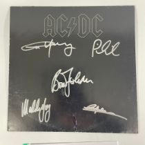 A signed ACDC Back to Black album, signatures to include Angus Young, Phil Rudd, Brian Johnson,