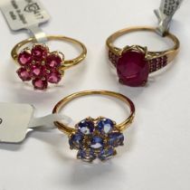 A collection of three 9ct yellow gold rings including a Cruzeiro rubellite ring; a Tanzanite ring