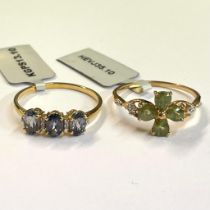 A three stone Mahenge blue spinel and white zircon ring in 9ct gold, along with a demantoid garnet