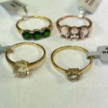 A group of three 9ct yellow gold along with a 9ct rose gold gem set rings All sized T 1/2. All