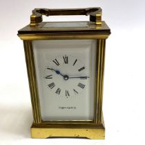 A Mappin and Webb brass carriage clock. 15cm tall.  Not currently running appears to be over wound.