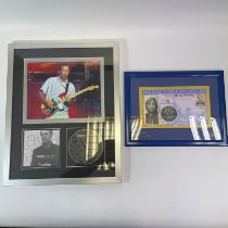 An Eric Clapton signed framed montage 39 cm x 49cm and a blue plaque collection signed George