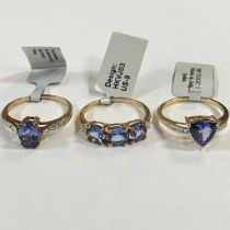 Three Tanzanite and diamond 9ct gold dress rings. To include a Tanzanite trilogy ring, with three