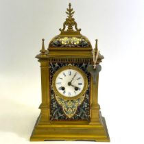 A Japy Freres Champleve Ormula bronze mantle clock with an enamel dial having Roman numerals.