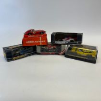 Four Scalextric racing cars and a Marklin Sprint Jaguar E type no. 1308 all boxed. Some wear to