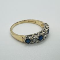 An 18ct yellow gold diamond and sapphire half hoop ring.  Size S.  Approximate weight 3.7 grams.