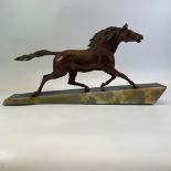 An Art Deco Style iron galloping horse on a marble base.  65cm x 32cm tall.  Rear leg appears to