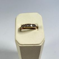 A 9ct yellow gold hallmarked 11 stone diamond ring, size P, approximately 2.6 grams.