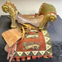 Of film interest: A saddle and book used in the 1964 film epic film "Becket", starring Peter O'