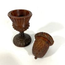 A 19th Century carved treen nutmeg grater.  6.5cm tall, some small chips to knobs otherwise