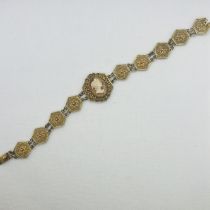 A filigree continental silver gilt cameo bracelet marked 800 (approximately 16.3 grams).